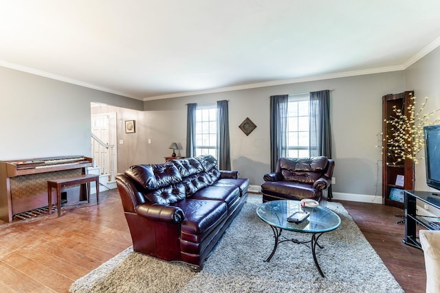 living room featuring hardwood / wood-style flooring and ornamental molding