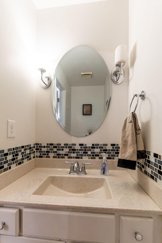 bathroom with backsplash and vanity