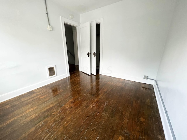 empty room featuring dark hardwood / wood-style floors