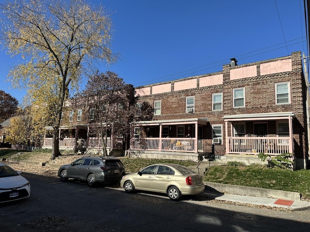 view of property with a porch