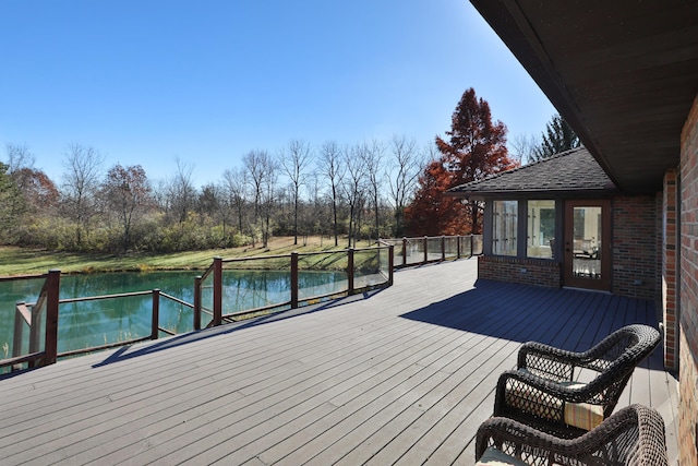 wooden deck featuring a water view