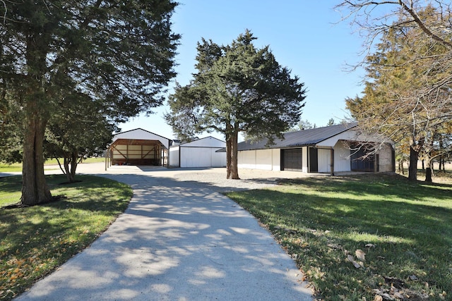 view of front of house featuring a front lawn and a carport