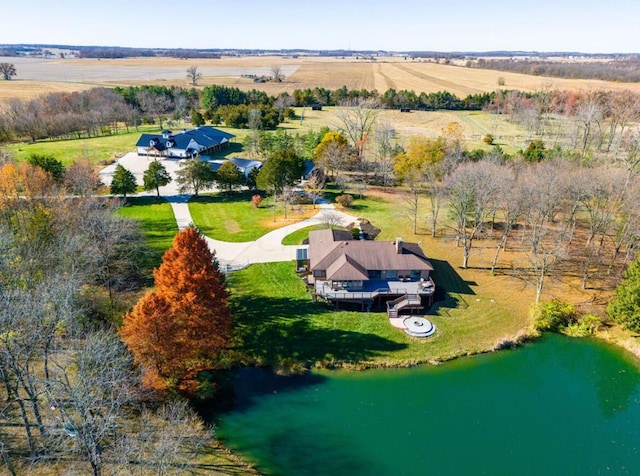 birds eye view of property featuring a water view and a rural view