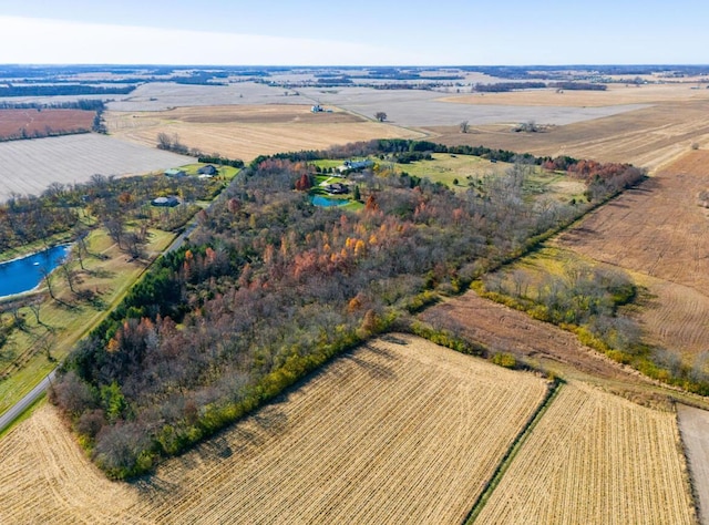 drone / aerial view featuring a water view and a rural view