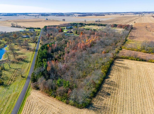 birds eye view of property featuring a rural view