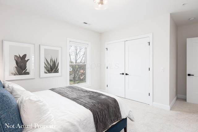 carpeted bedroom featuring a closet