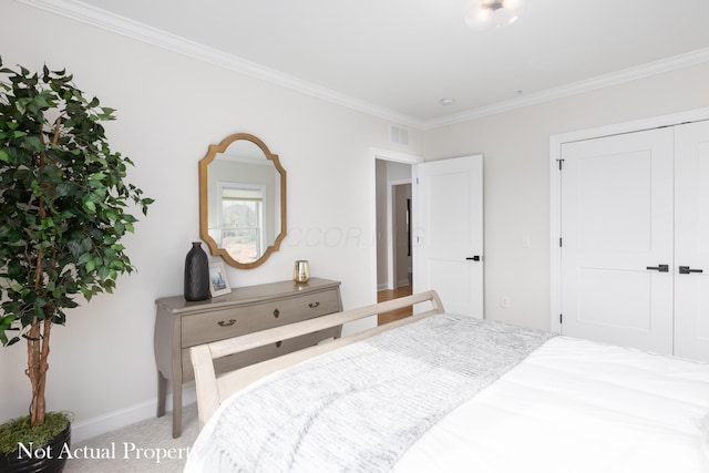 carpeted bedroom with a closet and ornamental molding