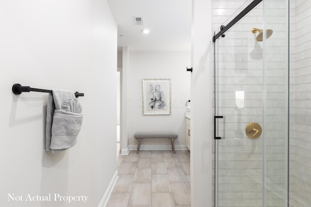 bathroom featuring hardwood / wood-style floors and walk in shower