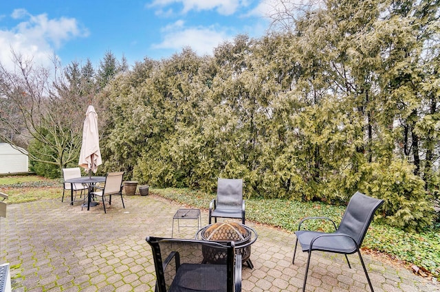 view of patio / terrace featuring a fire pit