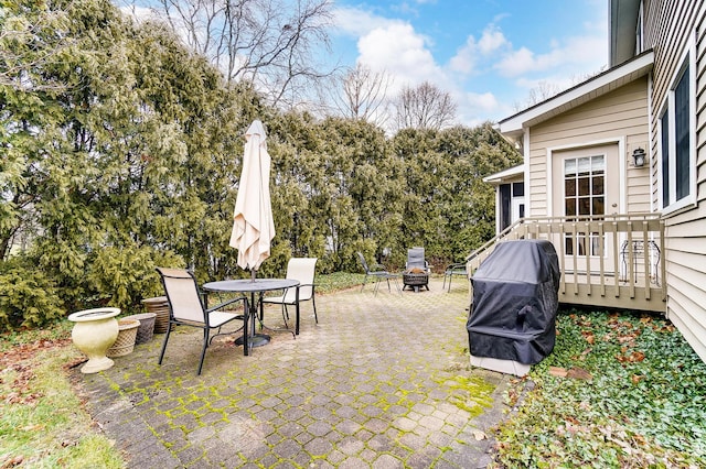 view of patio with a grill and a fire pit