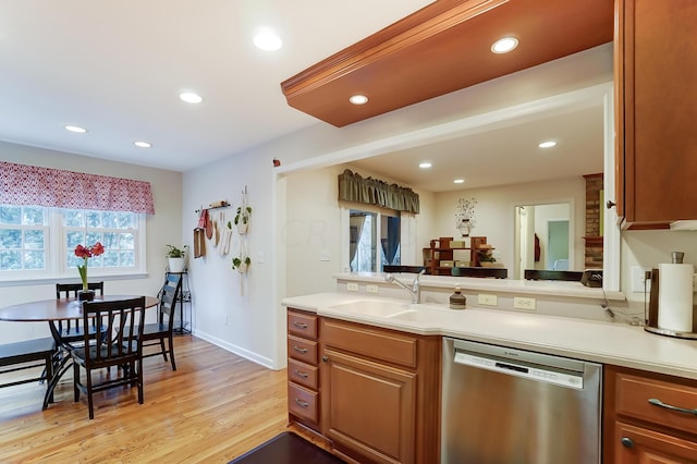 kitchen featuring light hardwood / wood-style floors, dishwasher, and sink