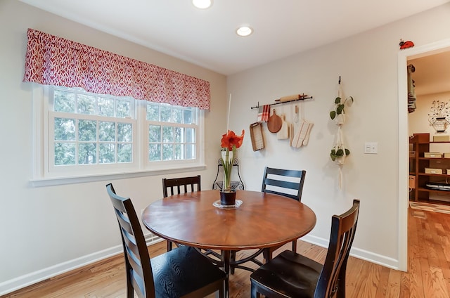 dining area with hardwood / wood-style flooring