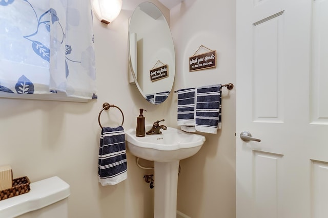 bathroom featuring toilet