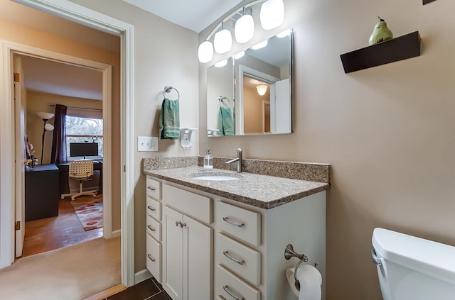 bathroom with vanity and toilet