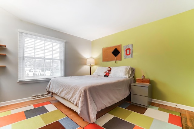 bedroom featuring hardwood / wood-style flooring