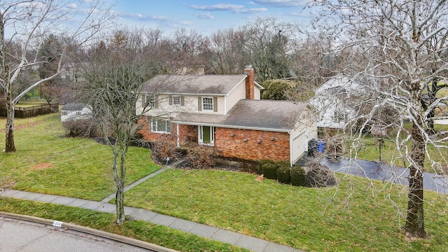 front facade with a garage and a front lawn