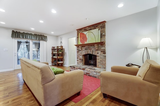 living room with a fireplace and light hardwood / wood-style floors