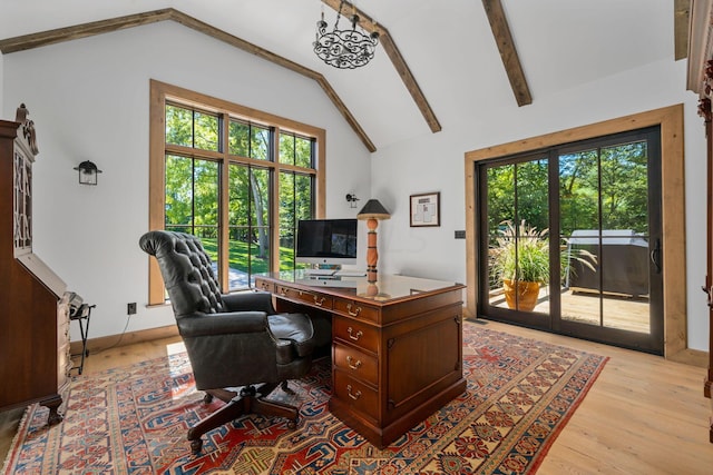 office featuring light hardwood / wood-style flooring and lofted ceiling with beams