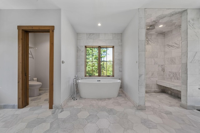 bathroom with toilet, tile walls, and independent shower and bath