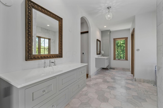 bathroom with a wealth of natural light and vanity