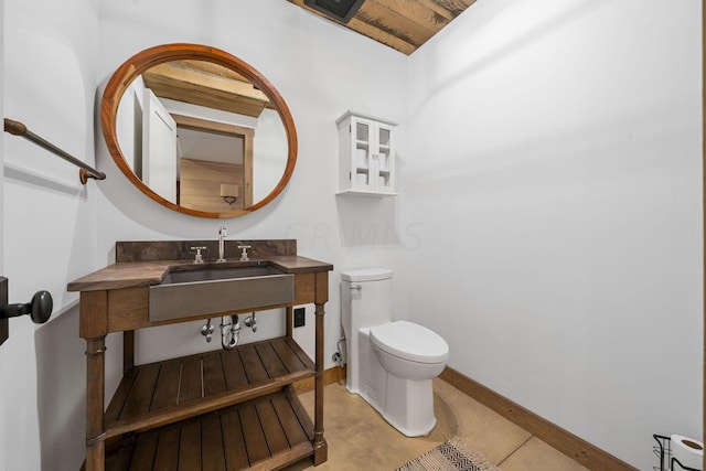 bathroom featuring sink and toilet