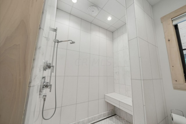 bathroom featuring a tile shower