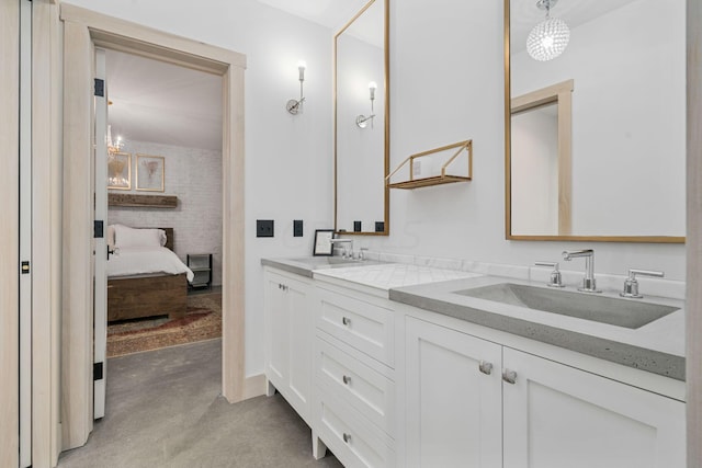 bathroom with vanity and concrete floors