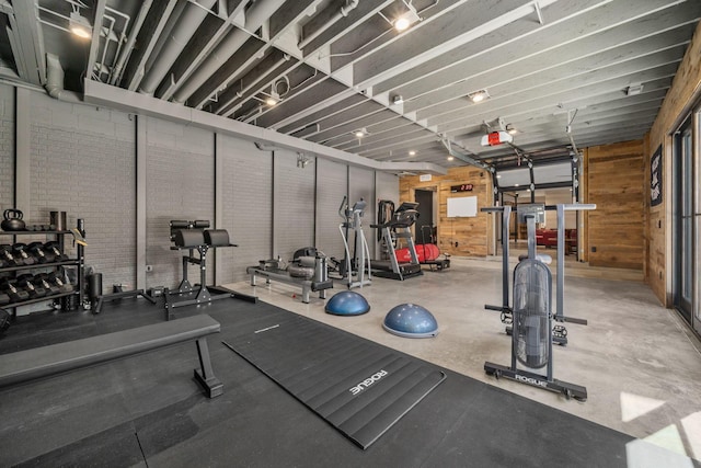 exercise room with wooden walls