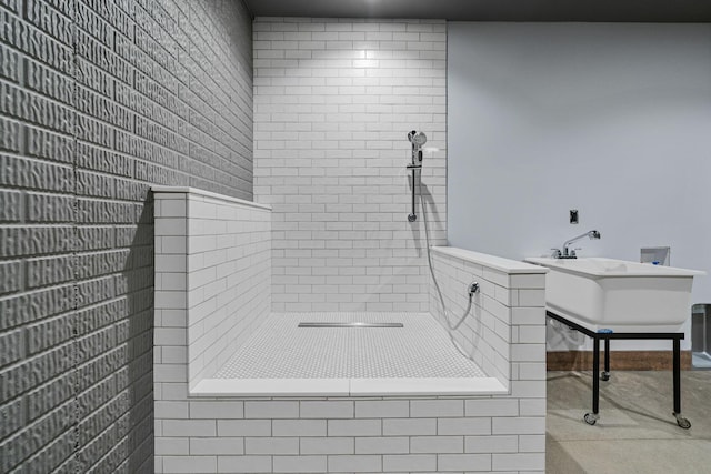 bathroom with a tile shower