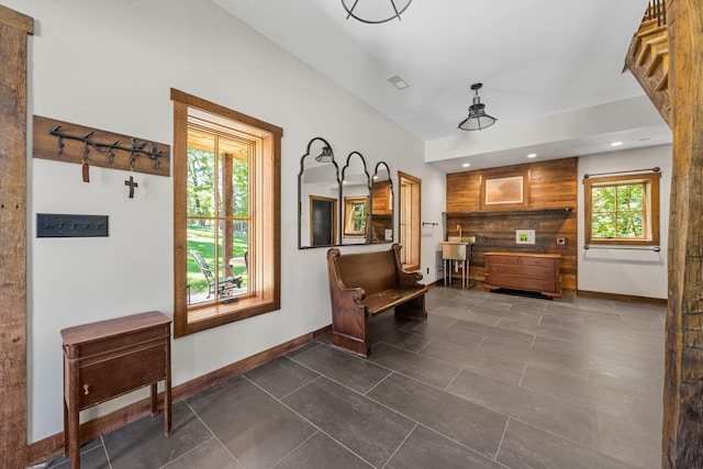 living area with dark tile patterned flooring