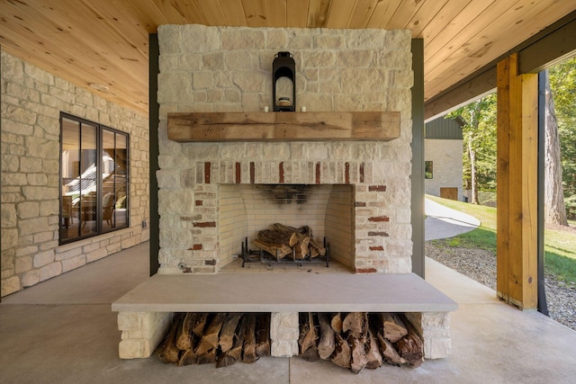 details with an outdoor stone fireplace