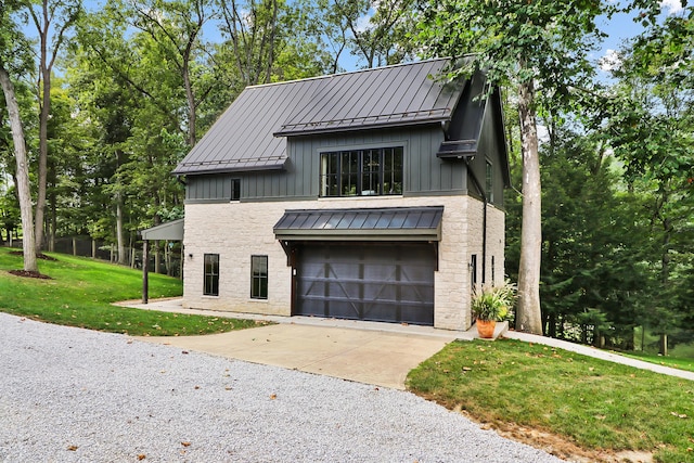 view of front of house with a garage and a front yard