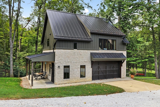 view of front of house with a garage and a front lawn