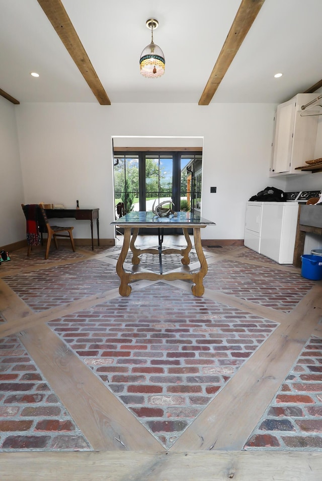 interior space featuring beamed ceiling, independent washer and dryer, french doors, and hardwood / wood-style floors