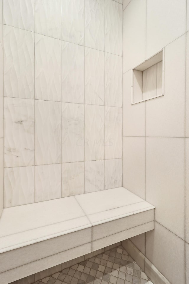 bathroom with tile patterned floors