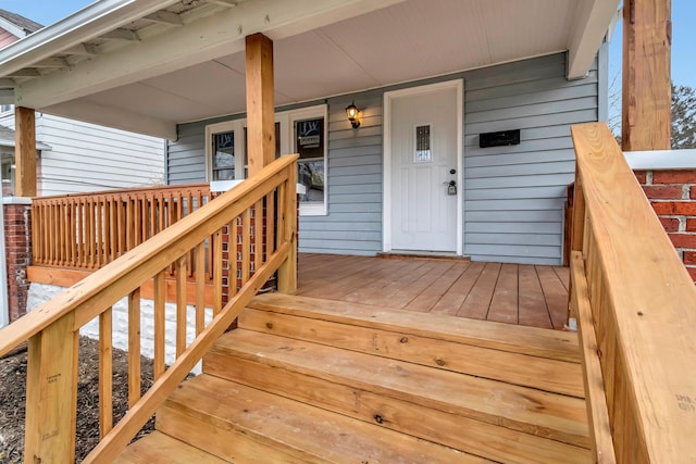 wooden terrace featuring a porch