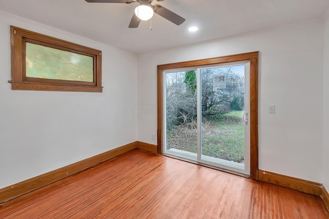 spare room featuring ceiling fan and light hardwood / wood-style floors