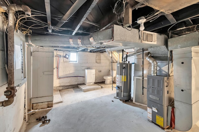 basement featuring heating unit and gas water heater