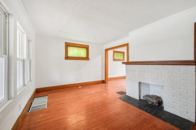 1366 Oakwood Ave, Columbus, OH 43206 - unfurnished living room with wood finished floors, a fireplace, plenty of natural light, and ornamental molding