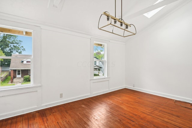 1366 Oakwood Ave, Columbus, OH 43206 - unfurnished dining area featuring a skylight, hardwood / wood-style flooring, a chandelier, and vaulted ceiling