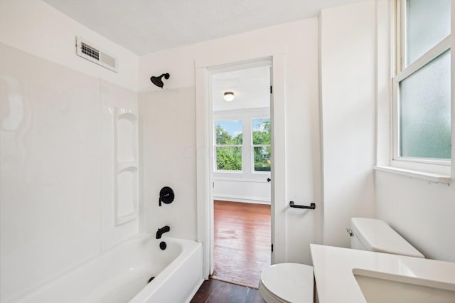 full bathroom with shower / bathing tub combination, toilet, wood-type flooring, and sink