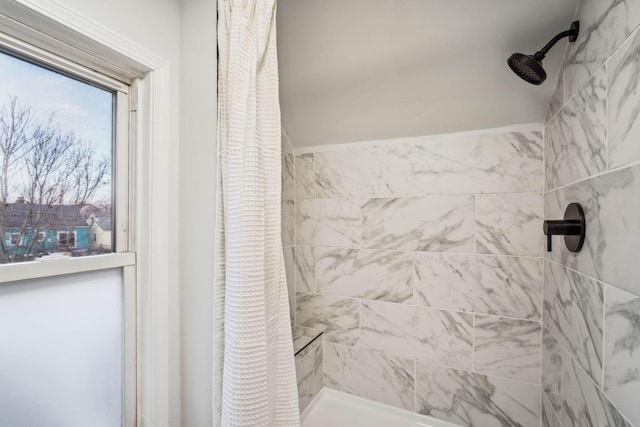 bathroom with a shower with shower curtain