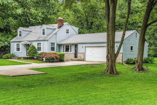 new england style home with a front yard and a garage