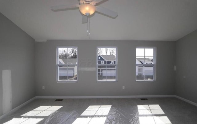 empty room with carpet and ceiling fan