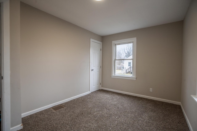 spare room featuring carpet flooring