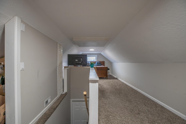 bonus room featuring carpet floors and lofted ceiling