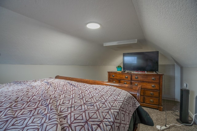 carpeted bedroom with lofted ceiling and a textured ceiling