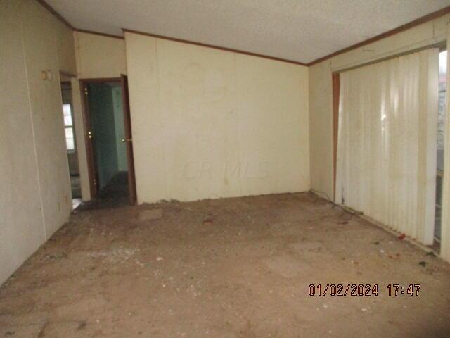 spare room featuring a textured ceiling