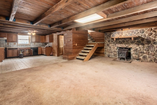 basement featuring a wood stove and wood ceiling