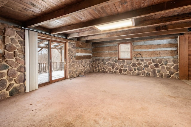 interior space with a healthy amount of sunlight, carpet floors, and wood ceiling